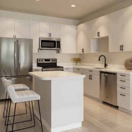 a kitchen with white cabinets