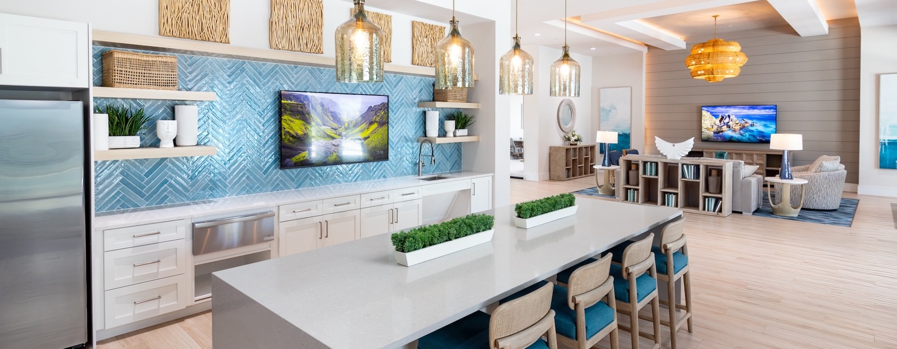 a kitchen with a bar and chairs